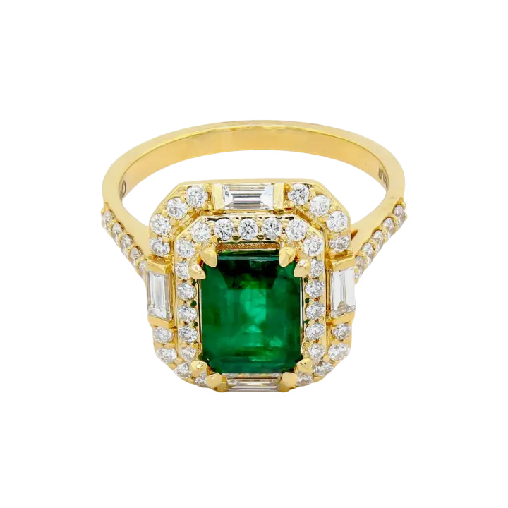 Emerald halo engagement ring in yellow gold with round and baguette diamond double halo