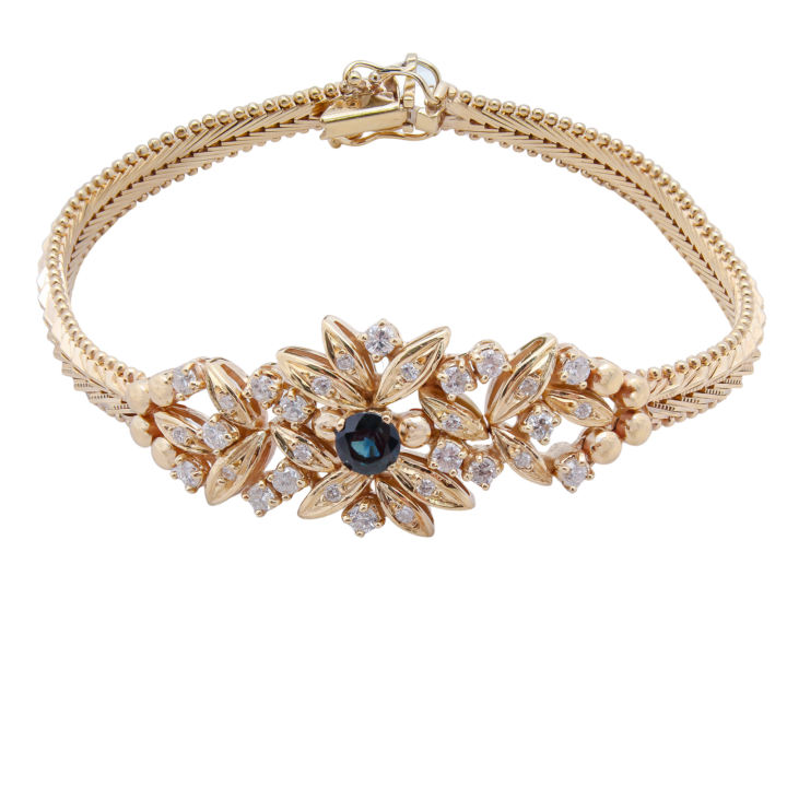 14k yellow gold floral cluster bracelet with blue sapphire center and round diamond accents