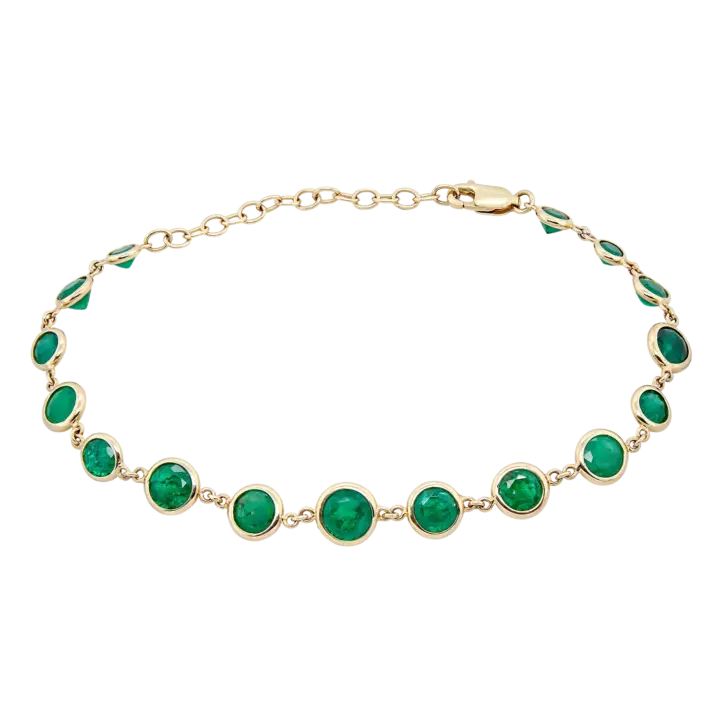 Bezel-set emerald station bracelet in 14k yellow gold with graduated round green emeralds