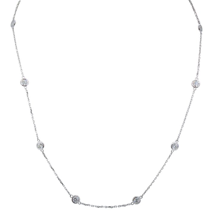 14k white gold diamond bezel station necklace with round brilliant diamonds evenly spaced along delicate chain