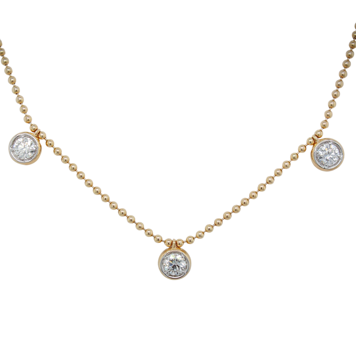 Three bezel-set round brilliant diamond drops on a 14k yellow gold ball chain necklace
